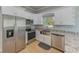 Modern kitchen with stainless steel appliances and granite countertops at 2905 E 21St Ave, Tampa, FL 33605