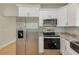 Modern kitchen with stainless steel appliances and granite countertops at 2905 E 21St Ave, Tampa, FL 33605