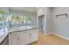 Kitchen island with granite countertops and white cabinets at 2905 E 21St Ave, Tampa, FL 33605