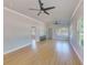 Open concept living area with hardwood floors and multiple windows at 2905 E 21St Ave, Tampa, FL 33605
