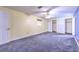 Large bedroom with ample closet space and neutral carpeting at 36919 Chancey Rd, Zephyrhills, FL 33541