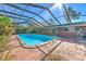 Bright blue rectangular pool under a screened enclosure at 36919 Chancey Rd, Zephyrhills, FL 33541