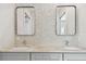 Bathroom with double vanity, gray cabinets and geometric tile at 3829 71St N St, St Petersburg, FL 33709
