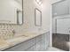 Modern bathroom with double vanity and geometric tile accents at 3829 71St N St, St Petersburg, FL 33709