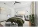 Bright bedroom with a large green comforter, wooden floors, and a private balcony at 3829 71St N St, St Petersburg, FL 33709