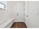 Clean hallway with built-in bench seating and white cabinets at 3829 71St N St, St Petersburg, FL 33709