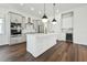 Modern kitchen with gray cabinets and white island at 3829 71St N St, St Petersburg, FL 33709