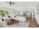Open living room and kitchen with hardwood floors, island, and ample natural light at 3829 71St N St, St Petersburg, FL 33709