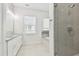 Elegant bathroom with double vanity, soaking tub, and glass shower at 3829 71St N St, St Petersburg, FL 33709
