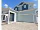 Two-story home with blue and light green siding at 3829 71St N St, St Petersburg, FL 33709