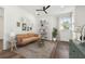 Bright sitting room featuring a comfy couch and built-in shelves at 3829 71St N St, St Petersburg, FL 33709
