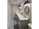 Modern bathroom with double vanity, new flooring and fixtures at 3963 Glen Oaks Manor Dr, Sarasota, FL 34232