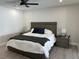 Main bedroom with a king-size bed and nightstands at 3963 Glen Oaks Manor Dr, Sarasota, FL 34232