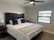 King-size bedroom with a wooden headboard and plenty of natural light at 3963 Glen Oaks Manor Dr, Sarasota, FL 34232