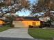 Single story home with attached garage and landscaped yard at 3963 Glen Oaks Manor Dr, Sarasota, FL 34232