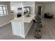 Modern kitchen with a large island and stainless steel appliances at 3963 Glen Oaks Manor Dr, Sarasota, FL 34232