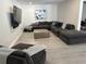 Spacious Gathering room with a large sectional sofa at 3963 Glen Oaks Manor Dr, Sarasota, FL 34232