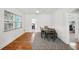 Dining area with hardwood floors, a table, and chairs, and access to kitchen at 56 W Park St, Tarpon Springs, FL 34689