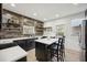 Modern kitchen featuring an island, stainless steel appliances, and wooden backsplash at 56 W Park St, Tarpon Springs, FL 34689