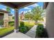 View from the front porch showing a walkway, landscaping and a residential street at 5938 Sweet Birch Dr, Riverview, FL 33578