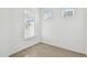Bright bedroom with wood floors and three windows at 9450 Shorebird Ct, Parrish, FL 34219