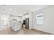Well-lit kitchen showcasing stainless steel appliances, island, and ample cabinet space for storage at 9450 Shorebird Ct, Parrish, FL 34219