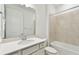 Clean bathroom featuring white vanity, sink, toilet, and shower-tub combination at 9454 Shorebird Ct, Parrish, FL 34219