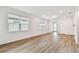 Spacious living room featuring wood floors, neutral walls and bright natural light at 9454 Shorebird Ct, Parrish, FL 34219