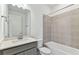 Bathroom with single vanity, tub, and tiled shower at 9462 Shorebird Ct, Parrish, FL 34219