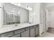 Bathroom with double vanity, glass shower and walk-in closet at 9462 Shorebird Ct, Parrish, FL 34219
