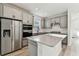 Modern kitchen boasts stainless steel appliances, gray cabinets, and quartz countertops at 9462 Shorebird Ct, Parrish, FL 34219
