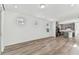 Open layout showcasing a living area that flows seamlessly into the modern kitchen at 9462 Shorebird Ct, Parrish, FL 34219