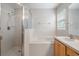 Clean bathroom with a shower/tub combo and wood vanity at 10230 Old Tampa Bay Dr, San Antonio, FL 33576