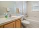 Clean bathroom with a tub, shower, and updated vanity at 10230 Old Tampa Bay Dr, San Antonio, FL 33576