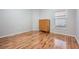 Simple bedroom with wood floors and a dresser at 10230 Old Tampa Bay Dr, San Antonio, FL 33576