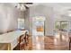 Open dining room and kitchen, hardwood floors, and view of patio at 10230 Old Tampa Bay Dr, San Antonio, FL 33576