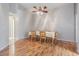 Dining room features hardwood floors and a lovely chandelier at 10230 Old Tampa Bay Dr, San Antonio, FL 33576