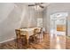 Bright dining room with hardwood floors and a view into the kitchen at 10230 Old Tampa Bay Dr, San Antonio, FL 33576