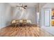 Bright dining room features wood flooring and a table with six chairs at 10230 Old Tampa Bay Dr, San Antonio, FL 33576