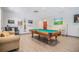 Relaxing game room with a pool table and comfortable seating at 10230 Old Tampa Bay Dr, San Antonio, FL 33576