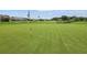 Golf course putting green with flag, showing a well-manicured lawn at 10230 Old Tampa Bay Dr, San Antonio, FL 33576
