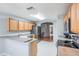 Kitchen with stainless steel appliances and light wood cabinets at 10230 Old Tampa Bay Dr, San Antonio, FL 33576