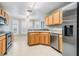 Kitchen features stainless steel appliances and light wood cabinets at 10230 Old Tampa Bay Dr, San Antonio, FL 33576