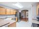 Modern kitchen featuring stainless steel appliances and light wood cabinets at 10230 Old Tampa Bay Dr, San Antonio, FL 33576