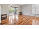 Living room with hardwood floors and sliding glass doors to patio at 10230 Old Tampa Bay Dr, San Antonio, FL 33576