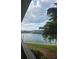 Scenic water view with lush landscaping and waterfront property in background at 106 1St E St # 110, Tierra Verde, FL 33715