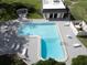 L-shaped pool with a surrounding deck and lounge chairs at 107 Caldwell Dr # 291, Brandon, FL 33510