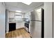 Updated kitchen with stainless steel appliances and light wood flooring at 107 Caldwell Dr # 291, Brandon, FL 33510