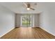 Spacious living room with laminate floors and balcony access at 107 Caldwell Dr # 291, Brandon, FL 33510
