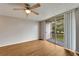 Spacious living room with laminate floors and balcony access at 107 Caldwell Dr # 291, Brandon, FL 33510